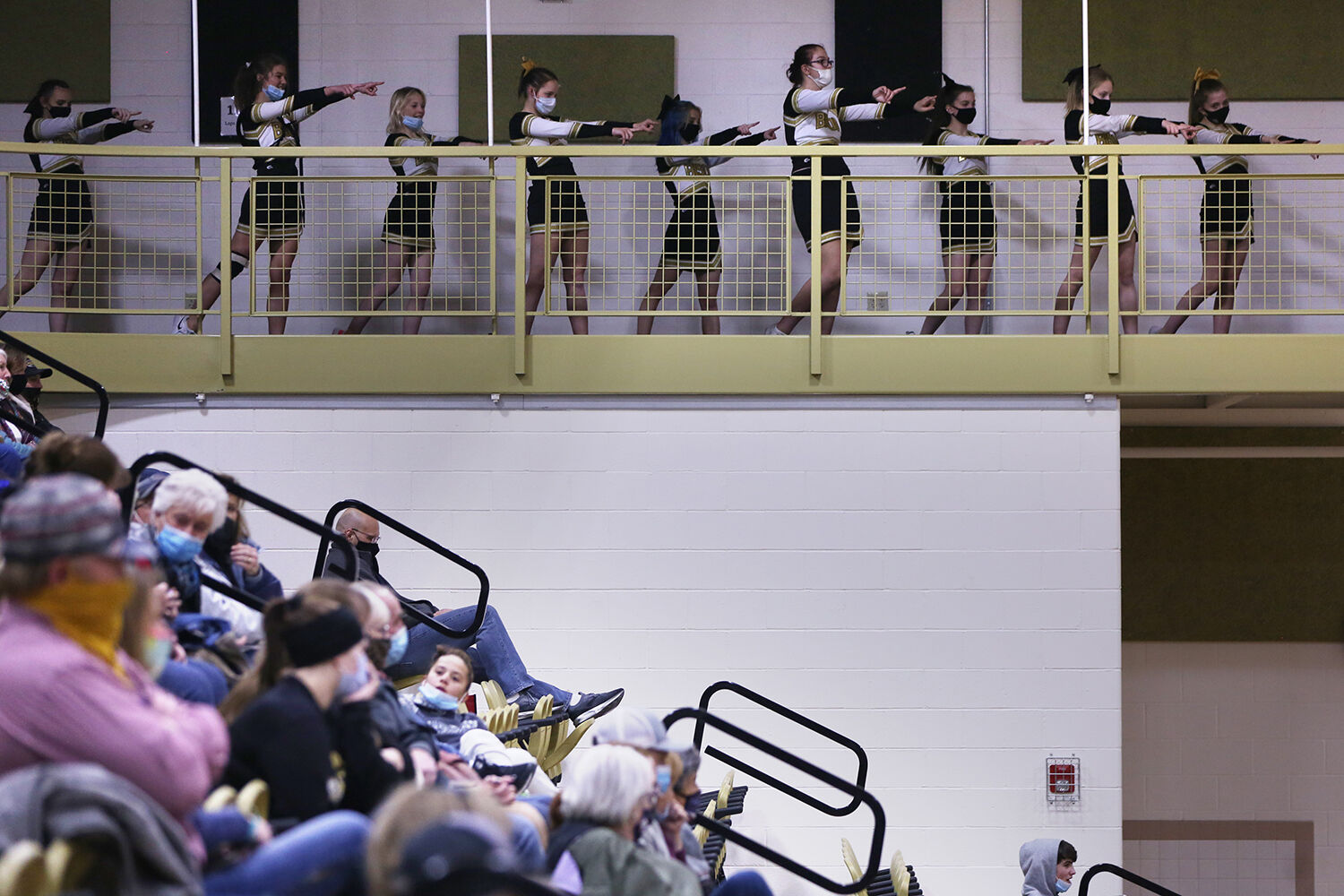Cheerleaders join the pep band in pointing at the Wheatland shooter